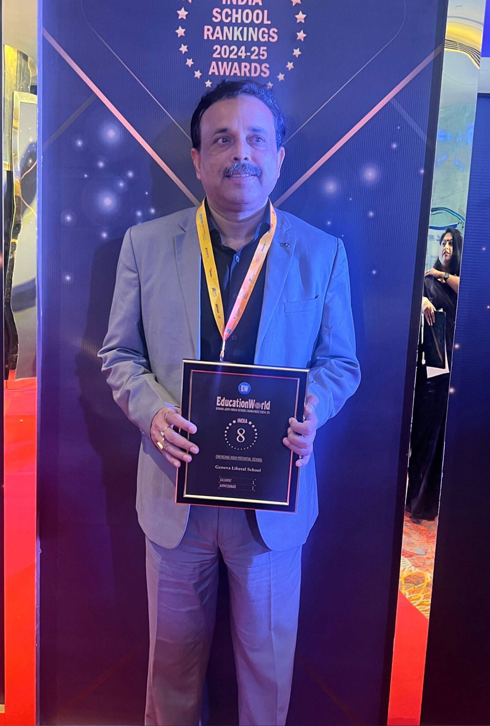 School representative holding the EducationWorld India School Rankings 2024-25 award plaque