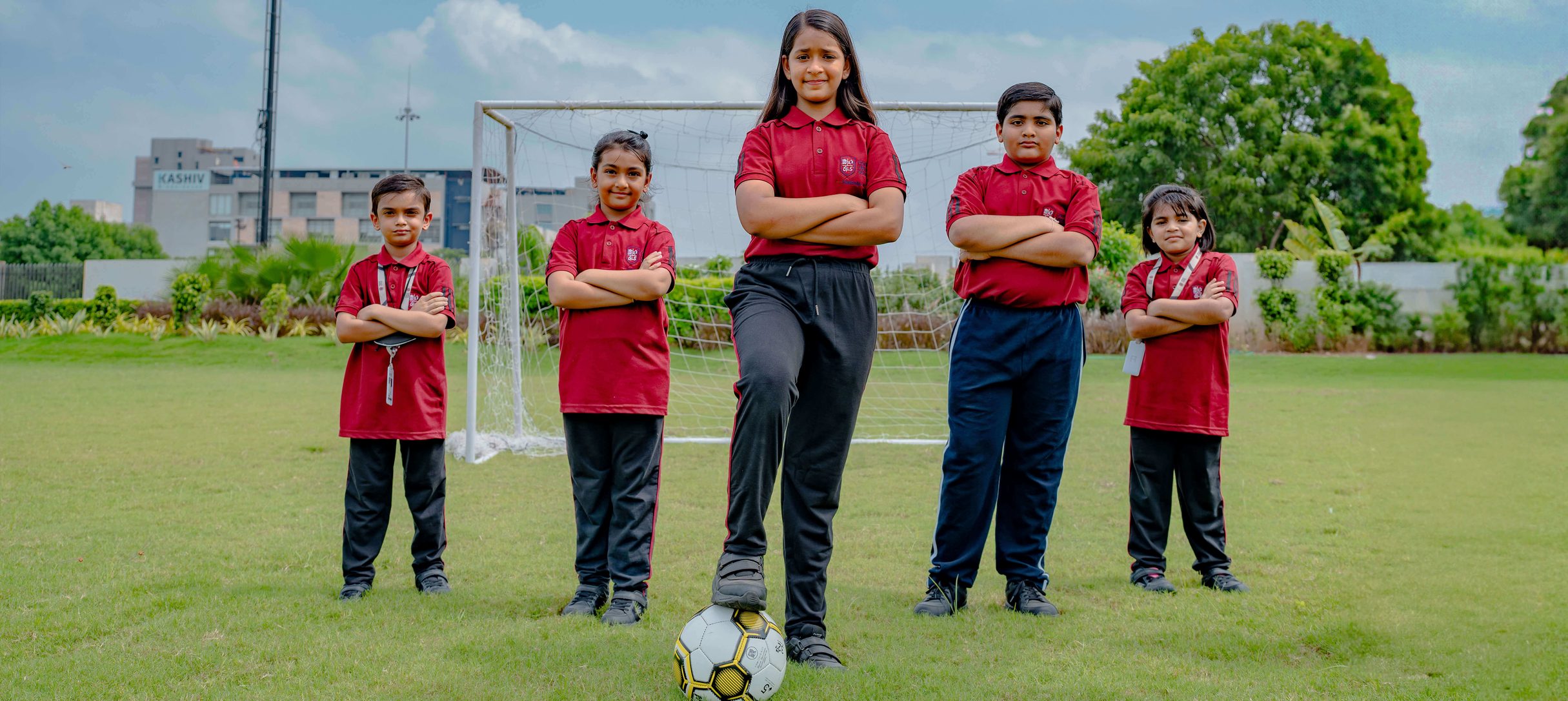 Students playing football on the school ground