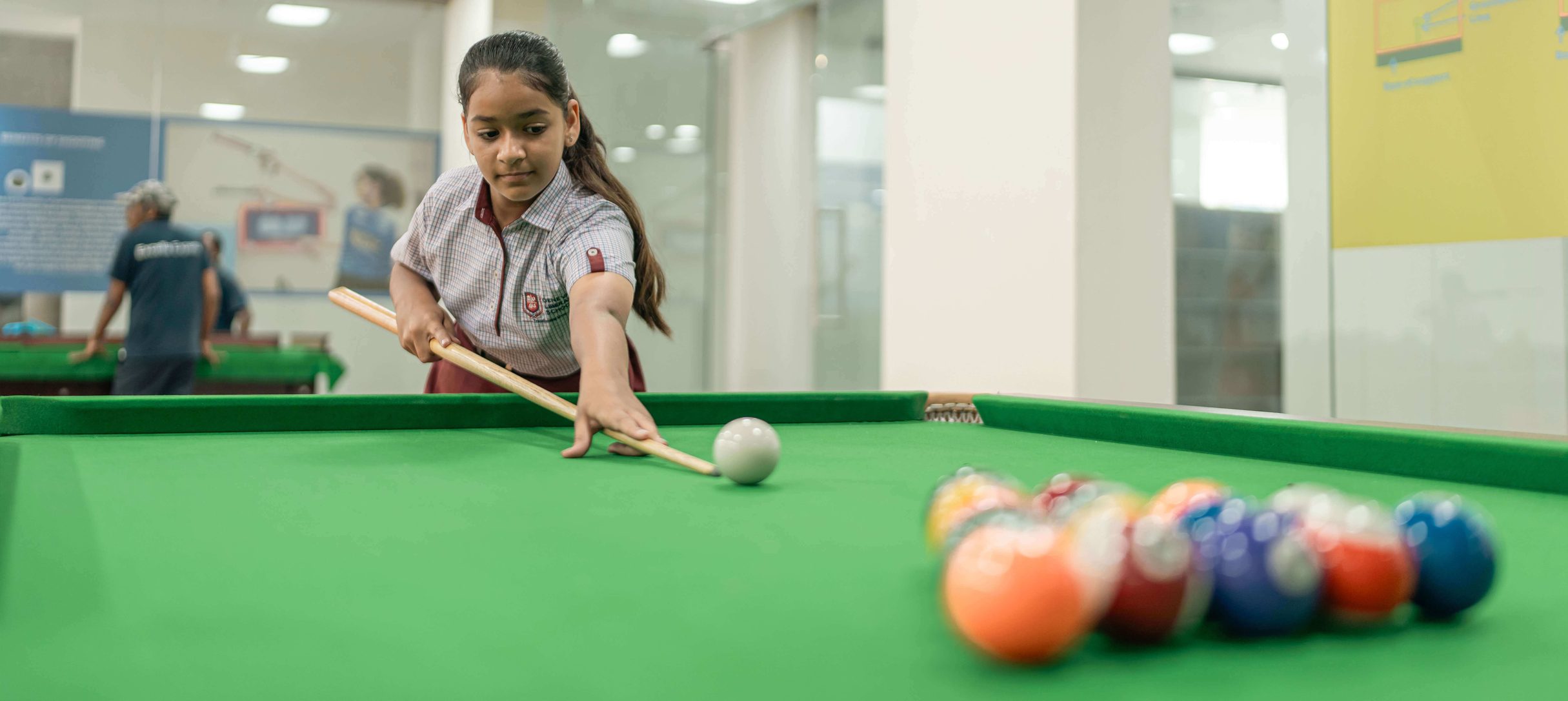 Students playing snooker at the school
