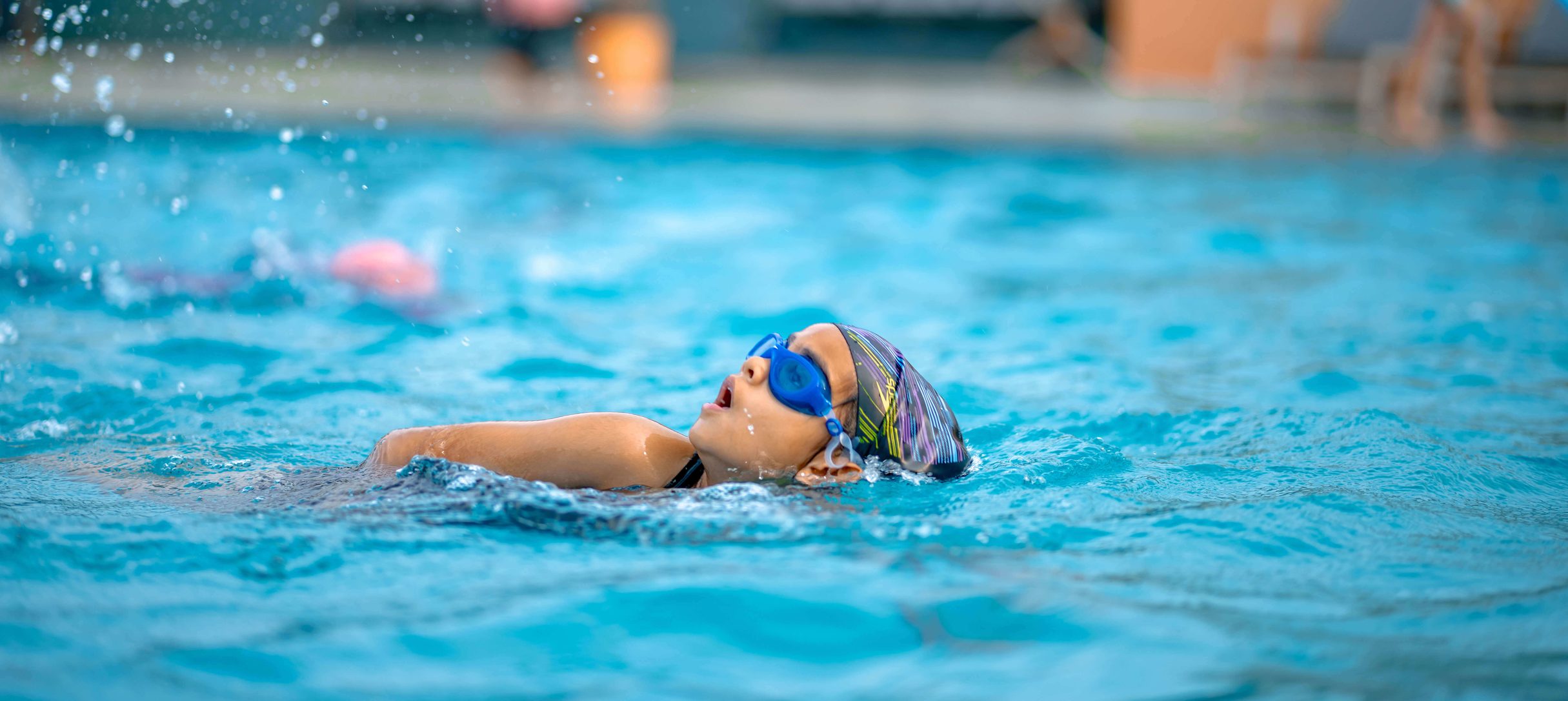 Student swimming in the school pool