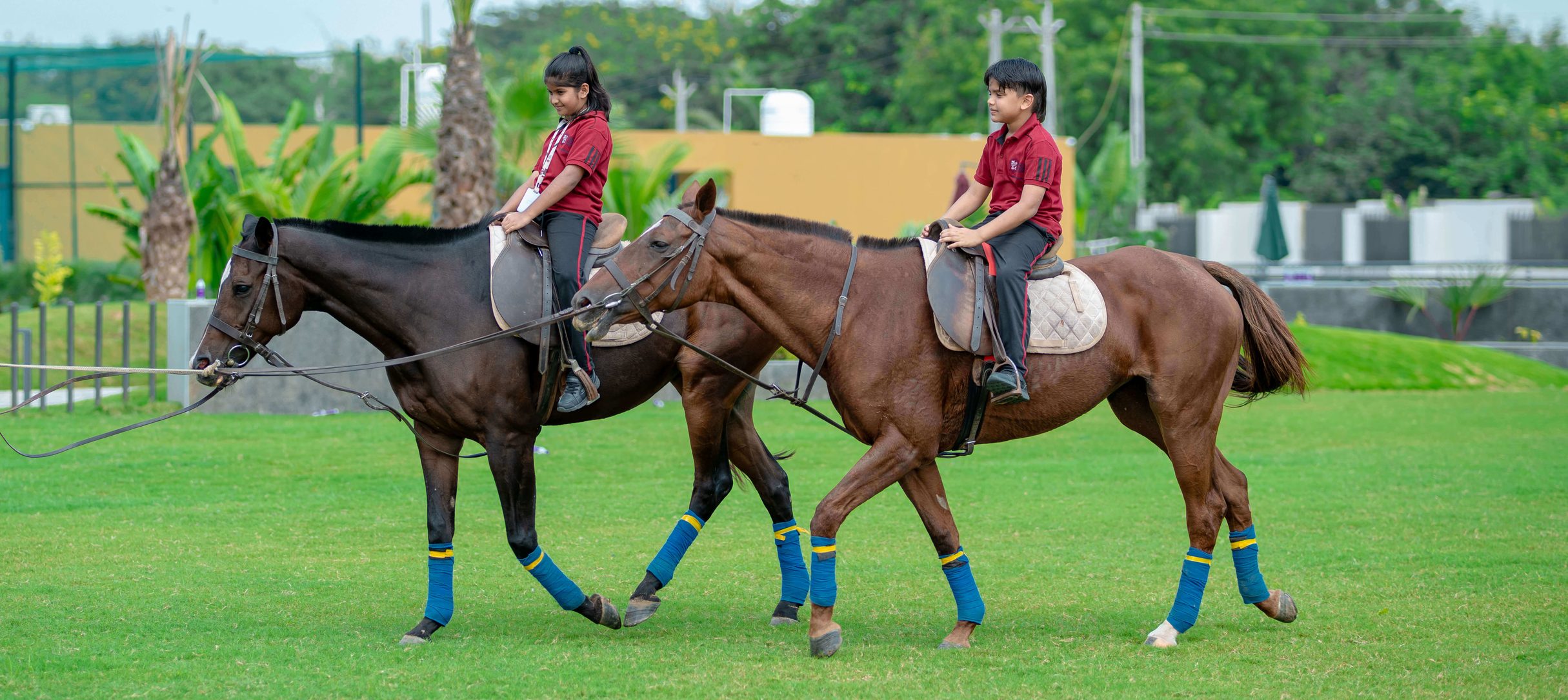 Student horse riding on the school campus