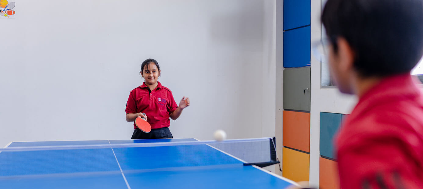 Students playing table tennis at the school