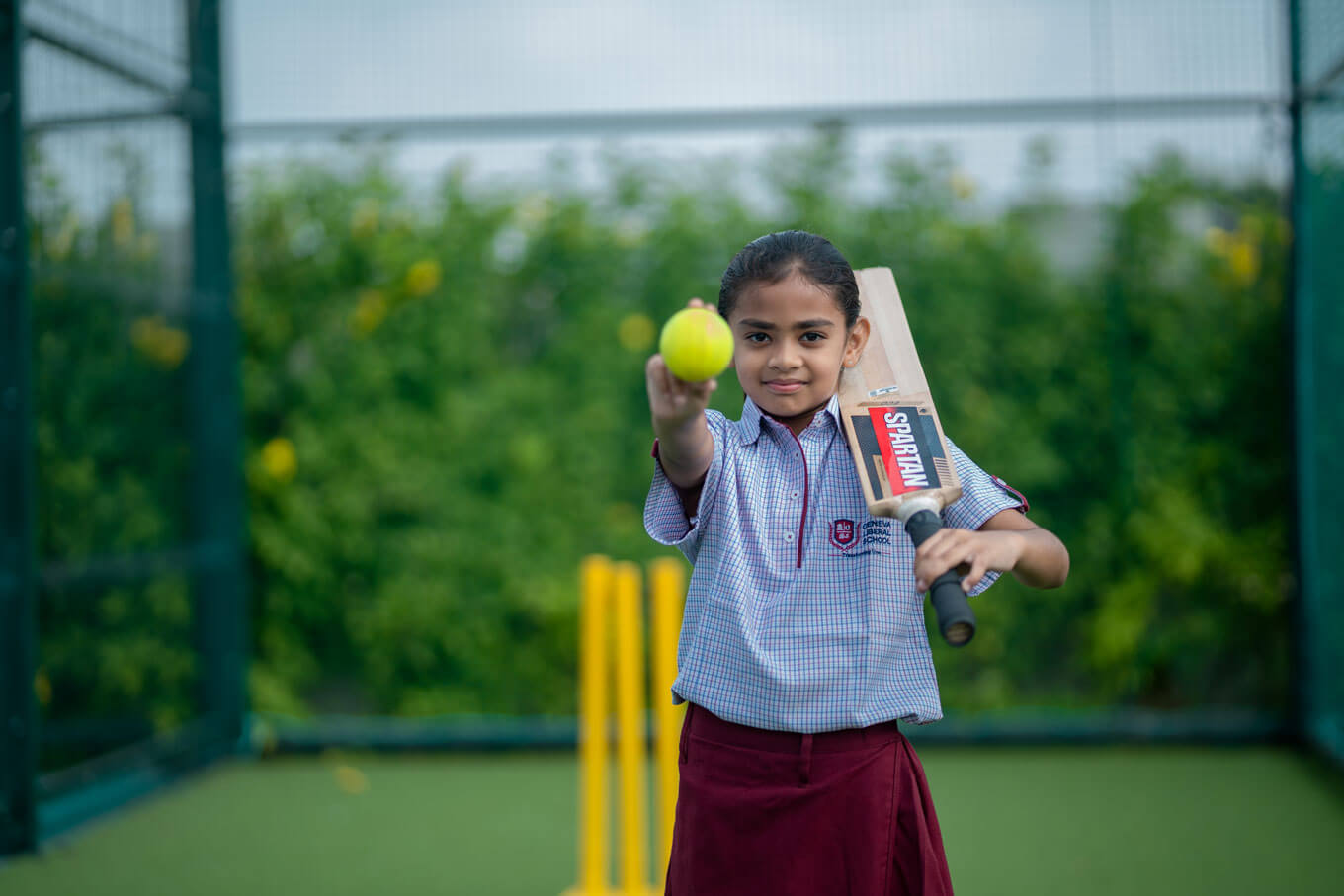 Students playing cricket at the school
