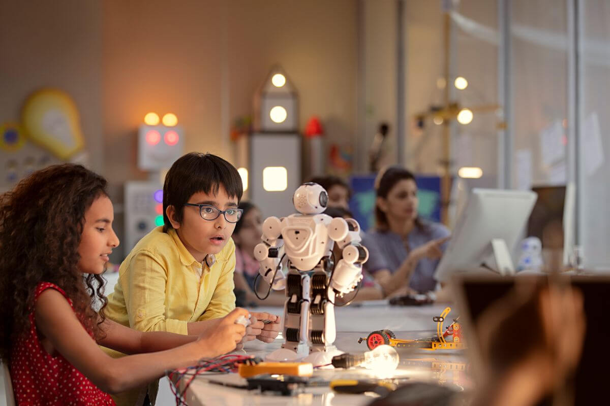 Students building a robot in the technology lab