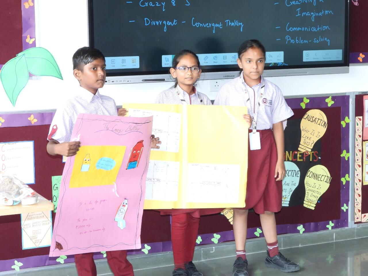 Students presenting a project poster during the StartupYou entrepreneurship programme